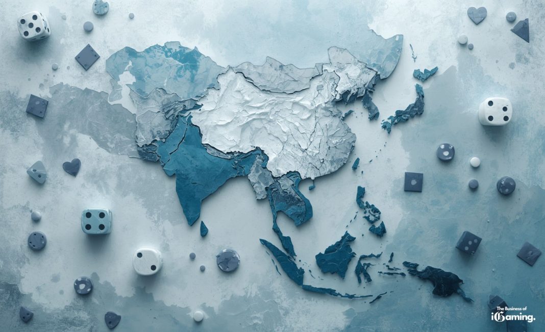 Stylized blue-toned map of Asia surrounded by dice and casino game elements representing the Asian iGaming market, branded The Business of iGaming