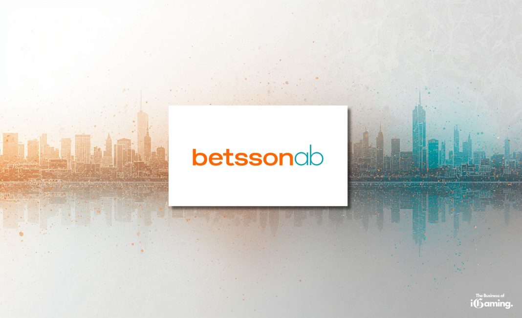Betsson AB logo centered over split orange and teal city skyline background with The Business of iGaming branding in the corner