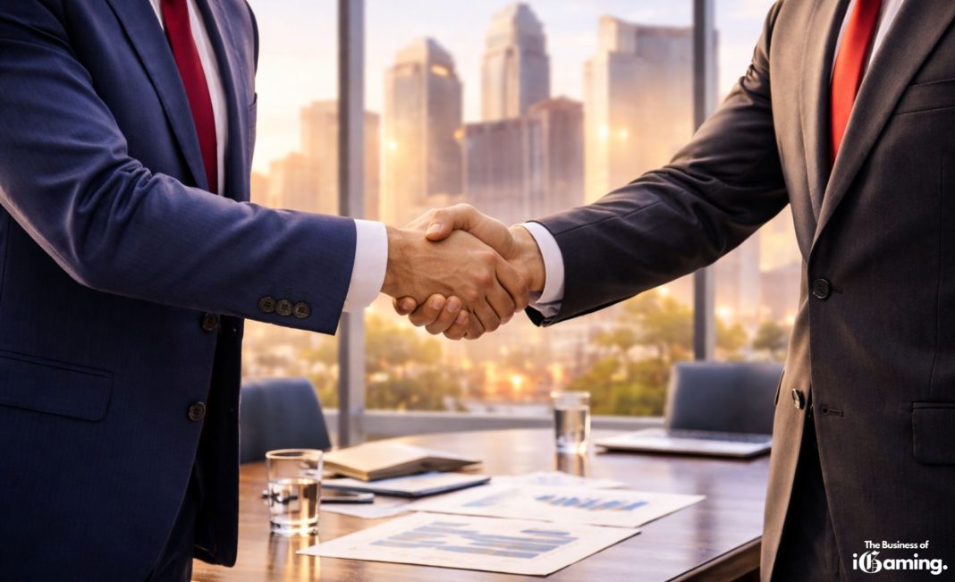 Business handshake in a modern conference room with city skyscrapers visible through large windows, symbolizing corporate mergers and acquisitions in the global iGaming industry.