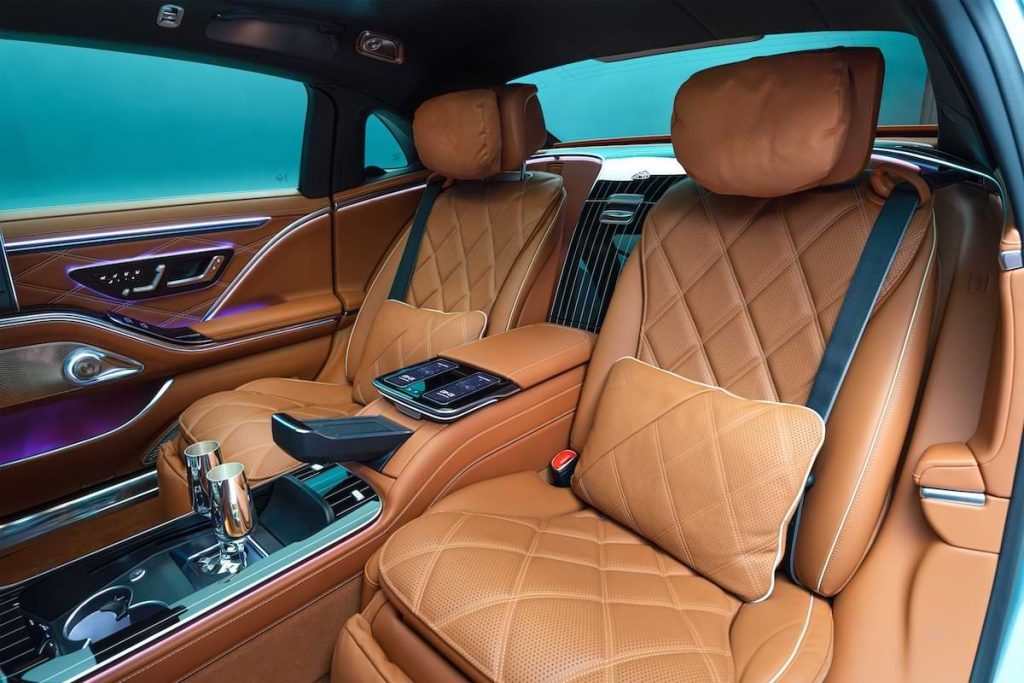 Rear cabin of the Mercedes-Maybach S-Class featuring quilted leather seats, ambient lighting and executive lounge seating