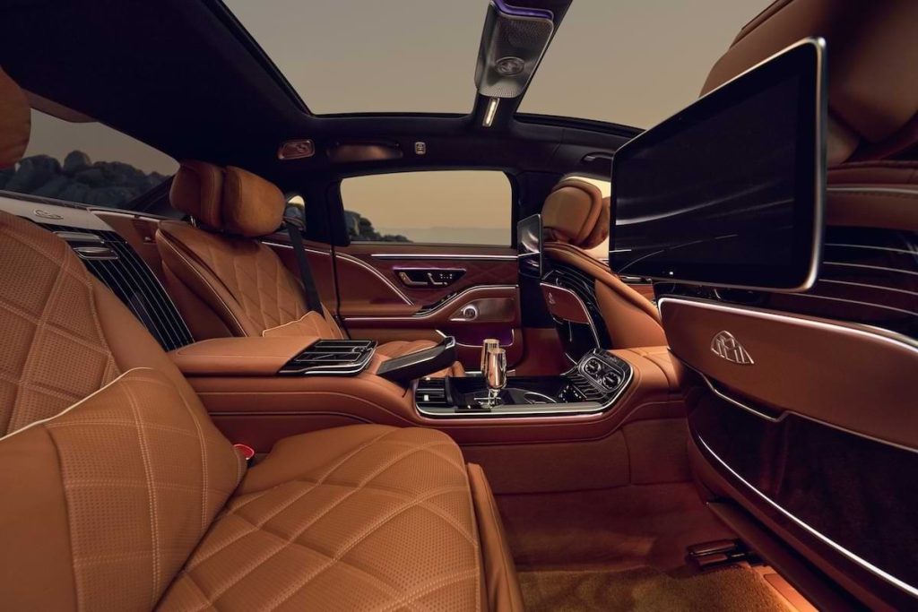 Mercedes-Maybach S-Class 2026 rear interior featuring luxury seating, panoramic sunroof and in-car entertainment screens